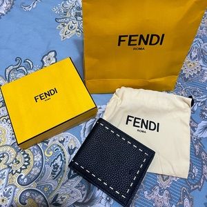 Fendi bi-fold wallet in black leather with metal accent